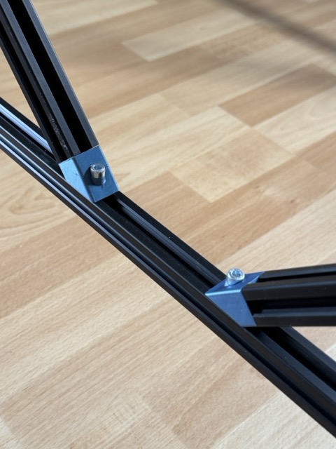 45 degree brace connectors installed on a 2020 T-slot extrusion frame
