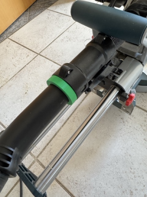 Close-up of the Bosch GCM 8 SDE to Metabo dust adapter installed on the saw