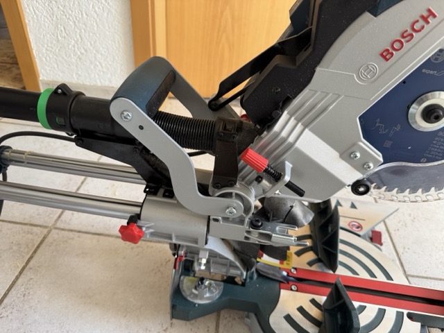 Dust extraction hose connected to a Bosch GCM 8 SDE miter saw with the adapter
