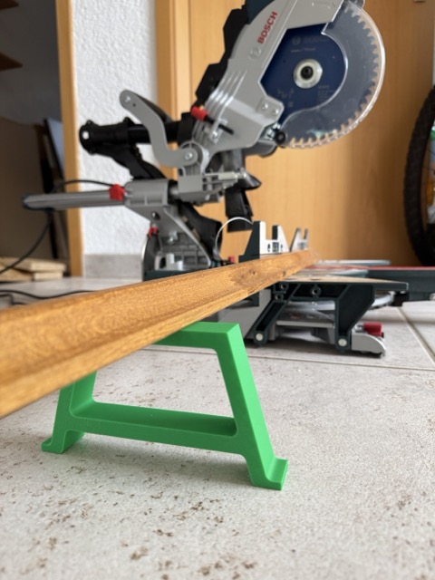 87 mm high workpiece support holding a board level with a Bosch GCM 8 SDE miter saw
